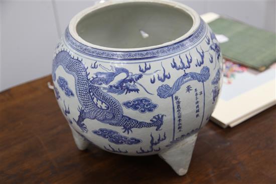 A massive Chinese blue and white dragon tripod censer, Qianlong mark and of the period (1736-95)